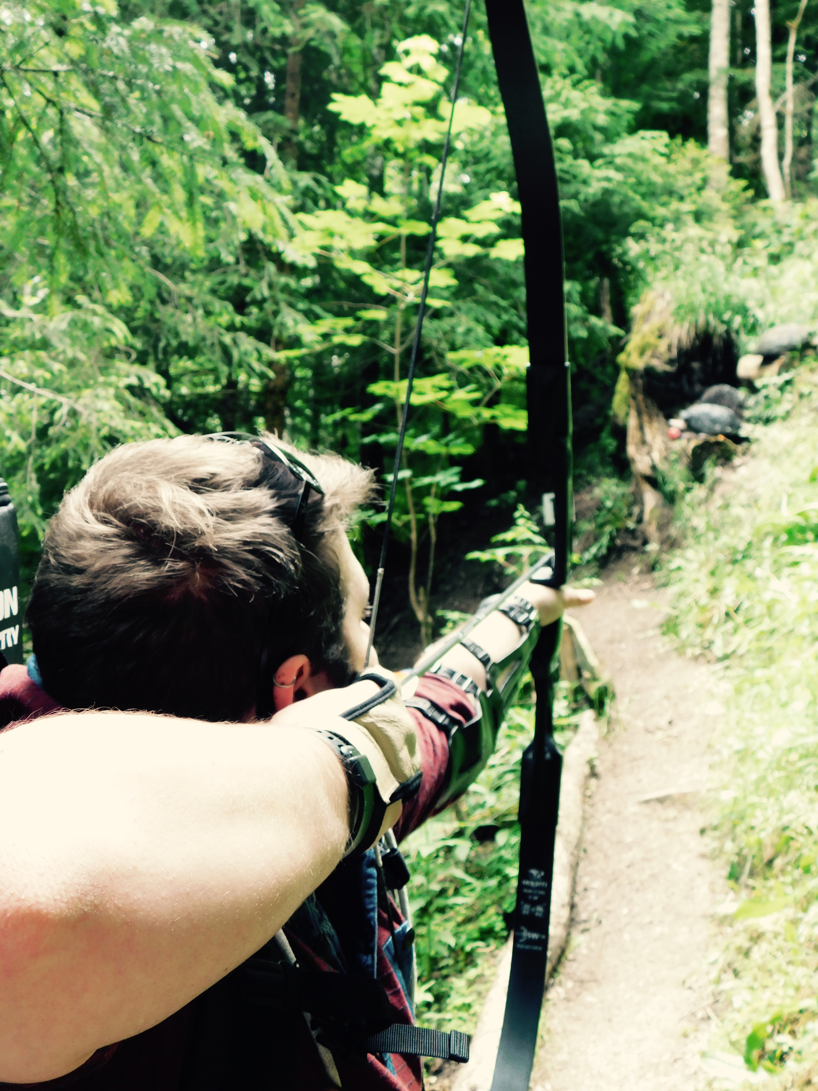 Alex shooting an archery